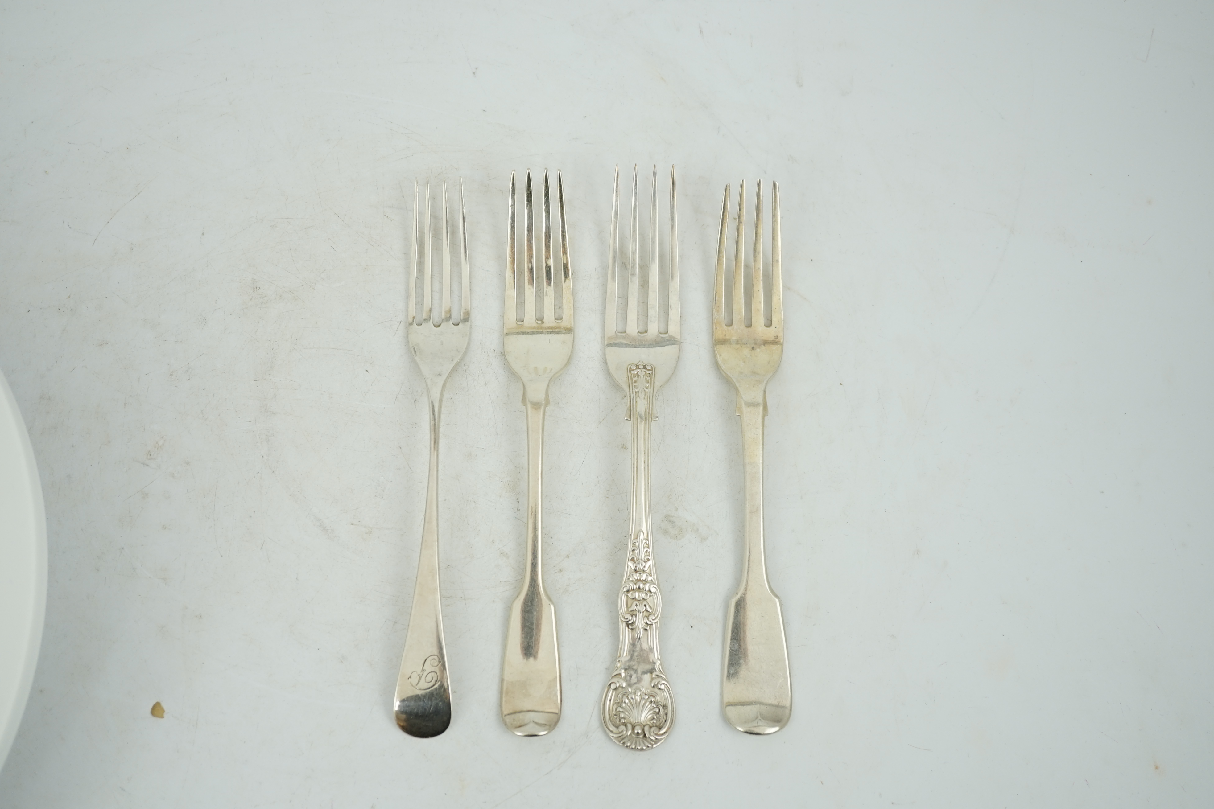 A harlequin collection of 19th century silver Old English pattern table forks, various dates and makers including set of ten by William Ellerby, London, 1804, thirty eight in total, together with sixteen similar fiddle p